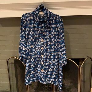 Blue tunic with cream/orange/blue color palette.